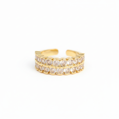 Gold and diamond ring on a white background