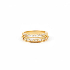 Two gold rings with diamond accents on a white background