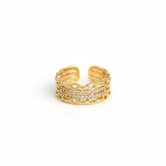 Gold ring with diamond accents on a white background