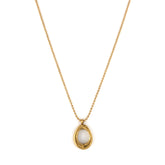 A gold-colored necklace with a uniquely sculpted open-circle pendant on a delicate beaded chain.