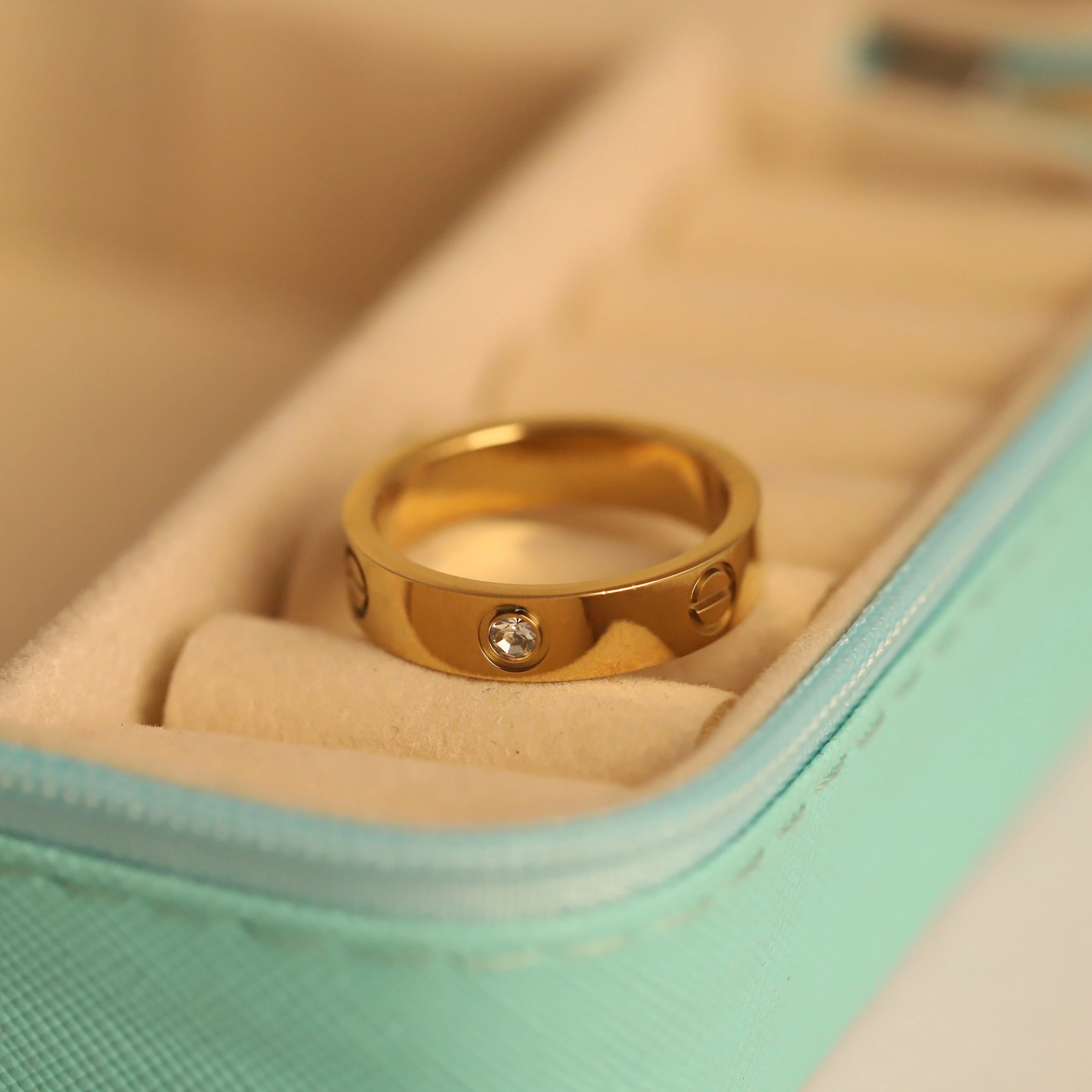 Gold ring with a diamond on a soft surface