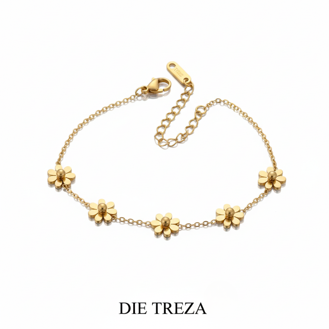 Gold bracelet with floral designs on a white background, branded 'DIE TREZA'.
