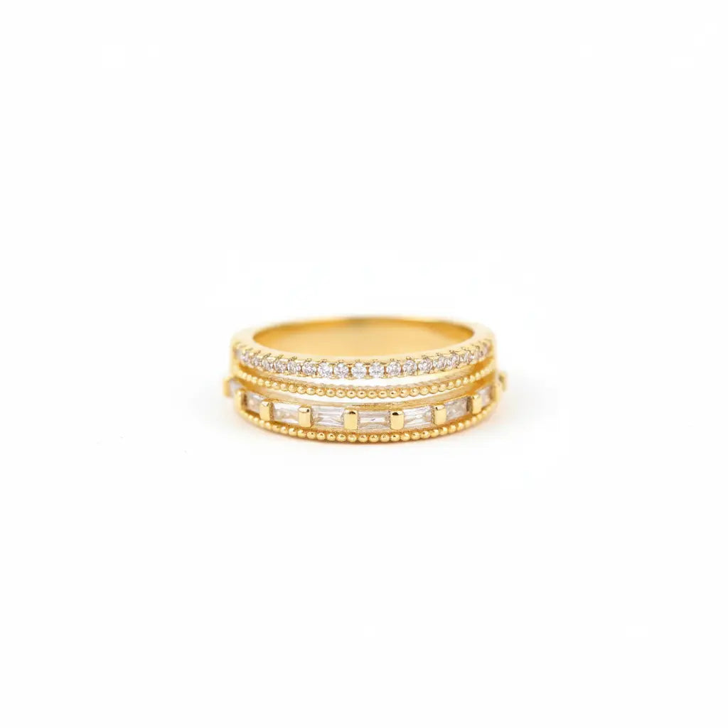 Two gold rings with diamond accents on a white background