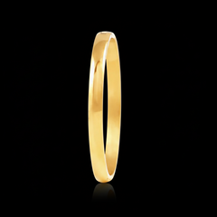 Gold ring on a black background