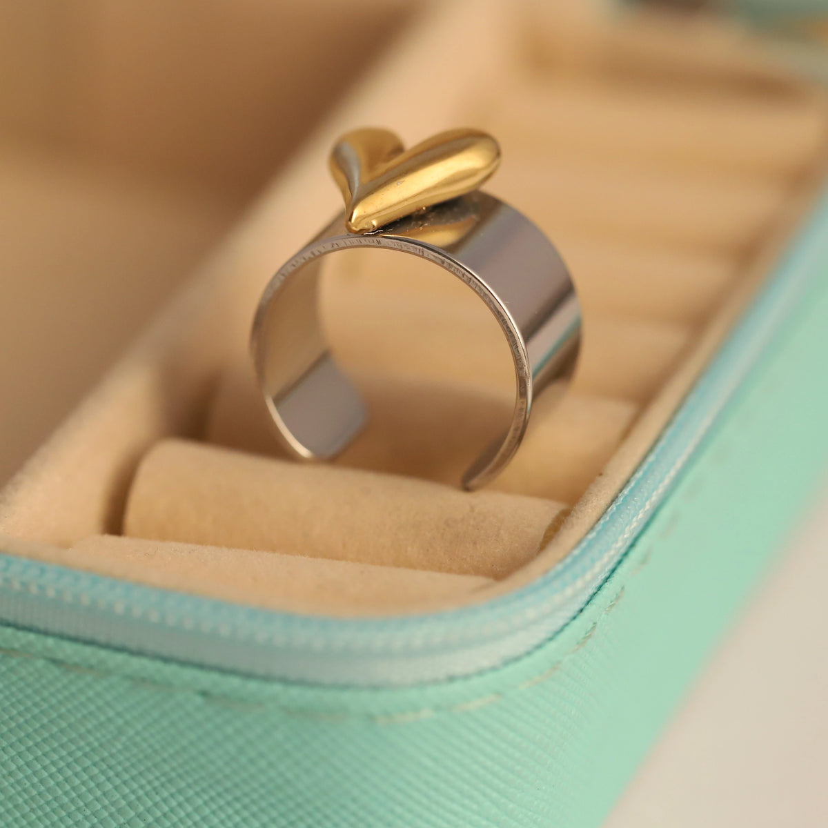 Gold and silver ring on a soft surface